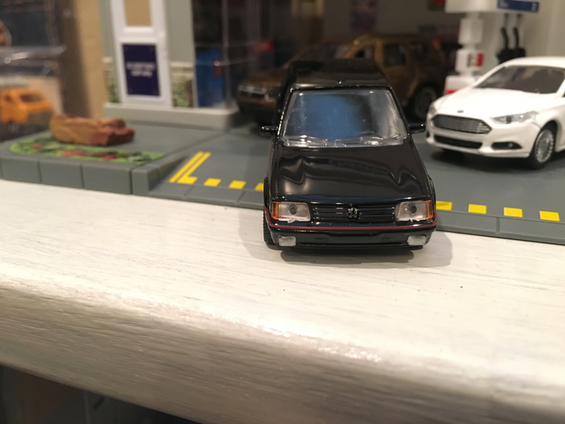 Illustration for article titled French Friday Norev Peugeot 205GTI 1:64 scale